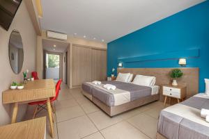 Voodi või voodid majutusasutuse Poseidon Beach Hotel toas