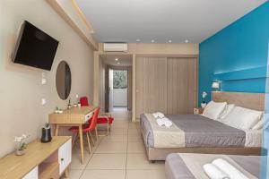 Voodi või voodid majutusasutuse Poseidon Beach Hotel toas