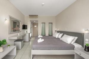 Voodi või voodid majutusasutuse Poseidon Beach Hotel toas