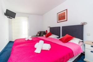 Postel nebo postele na pokoji v ubytování Hotel Dubrovnik
