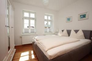 Ένα ή περισσότερα κρεβάτια σε δωμάτιο στο Gästehaus Schimmel´s