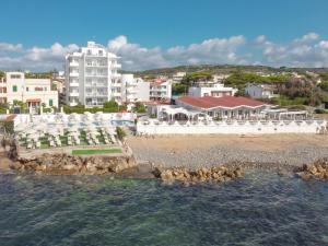 a view of a resort from the water at Hotel Cavalluccio Marino in Santa Marinella