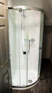 a shower with a glass door in a bathroom at The Tushmore in Crawley +30 photos