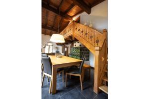 a dining room with a wooden table and chairs at Chalet Hochkrimml 49 in Nothdorf