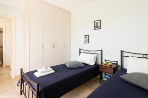 Ένα ή περισσότερα κρεβάτια σε δωμάτιο στο Villa Palmier