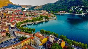 an aerial view of a town next to a river at CENTROLAGO in Lecco