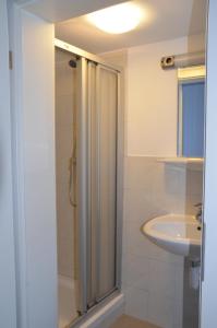 a bathroom with a shower and a sink at Gasthaus Löwen in Unterreichenbach