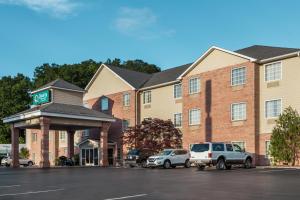 a hotel with cars parked in a parking lot at Quality Inn & Suites in Big Stone Gap