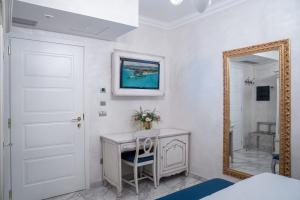 Cama ou camas em um quarto em Hotel Colomba D'Oro
