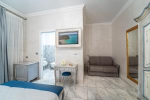 Cama ou camas em um quarto em Hotel Colomba D'Oro