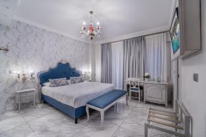 Cama ou camas em um quarto em Hotel Colomba D'Oro