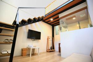 Televisyen dan/atau pusat hiburan di Windhouse B&B