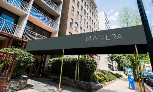 a black awning with the name of a madera on a building at Hotel Madera in Washington