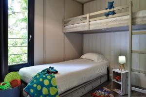 a bedroom with a bunk bed and a bunk bed at Résidence & Hotel U Livanti ECOLABEL in Propriano