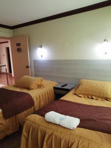 a hotel room with two beds and a room with two at Le Ciel d'Uyuni in Uyuni