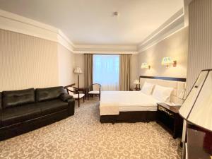 Postel nebo postele na pokoji v ubytování Sofievsky Posad Hotel
