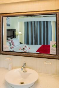Voodi või voodid majutusasutuse Baker's Suites toas