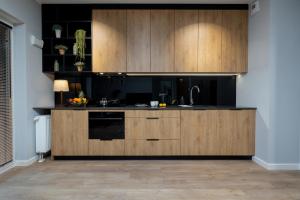 Kuchyňa alebo kuchynka v ubytovaní Exclusive Apartments Mostowa by Renters Prestige