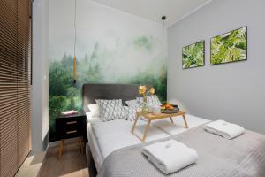 Posteľ alebo postele v izbe v ubytovaní Exclusive Apartments Mostowa by Renters Prestige + 37 fotografií