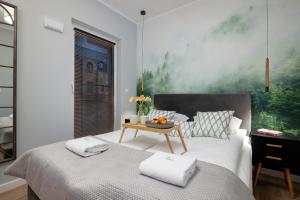 Posteľ alebo postele v izbe v ubytovaní Exclusive Apartments Mostowa by Renters Prestige