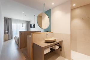 a bathroom with a sink and a mirror at Hotel Maritim in Roses