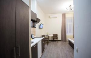 TV a/nebo společenská místnost v ubytování Khreshchatyk Apart Hotel Passage