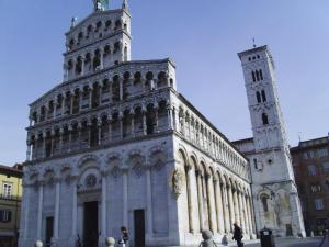 a large building with a tower and a church at La Terrazza da Ernestina in Lucca