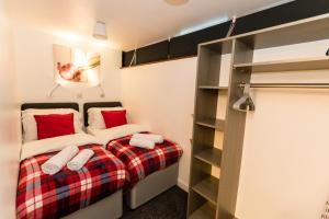 a bedroom with a bed and a book shelf at Newton Apartment nr Wigan Hospital in Wigan