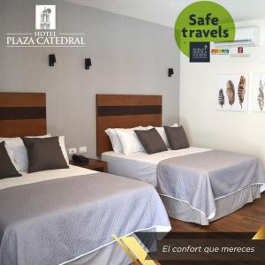 Una cama o camas en una habitación de Hotel Plaza Catedral