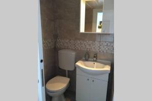 Koupelna v ubytování Apartman Knezovic + 17 fotografií