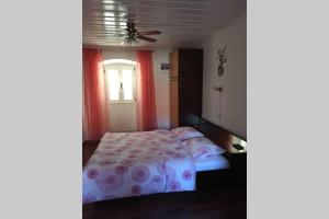 Postel nebo postele na pokoji v ubytování Apartman Knezovic