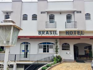 a white building with the words breakfast hotel at Brasil Hotel in Três Pontas