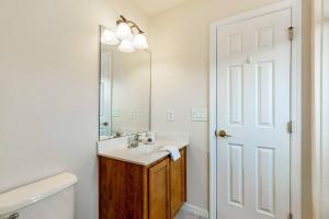 a bathroom with a sink and a mirror at Gorgeous Davenport 5 Bed Villa with Pool Hot Tub in Davenport +23 photos