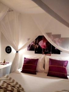 Кровать или кровати в номере Pousada Flor de Pitaya