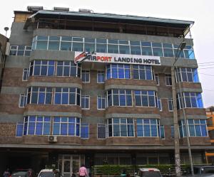 a building with a sign on the front of it at Airport Landing Hotel in Nairobi