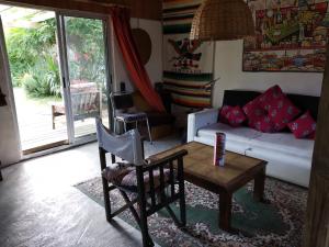 a living room with a couch and a table at Para pasar bien! in Maldonado