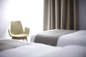 Postel nebo postele na pokoji v ubytování BLEECKER Hotels