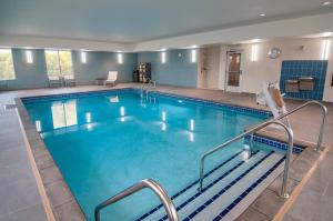 a large swimming pool with blue water at Hyatt Place Sioux Falls South in Sioux Falls