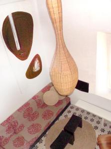 a vase sitting on top of a floor with a rug at Apartamentos Casa del Coronel in Tarifa