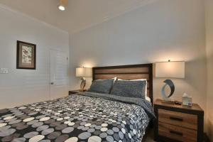 a bedroom with a large bed and two lamps at 1000#1 Contemporary Home w/ Parking, Grill, & AC! in Newport Beach