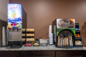 a counter with a coffee maker and a box on it at Red Roof Inn Dahlgren - Naval Base in Dahlgren