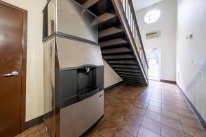 a hallway with a spiral staircase in a house at Red Roof Inn Dahlgren - Naval Base in Dahlgren