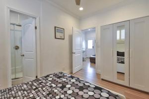 a bedroom with a bed with a black and white blanket at 1000#3 Renovated Home by Beach & Sand - AC & More! in Newport Beach