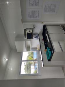 an overhead view of a kitchen with a window at Casa Nova Bertioga - SESC - Vista Linda - Riviera - Prainha Branca in Bertioga