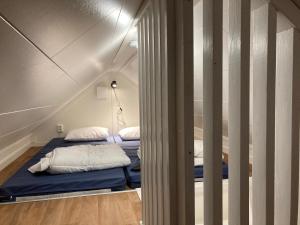 a room with two beds in a small room at Smeakallesbod in Tvååker