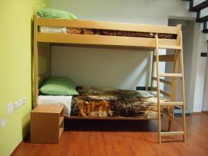 a bunk bed in a room with a box at Hostel Savski Most in Zagreb