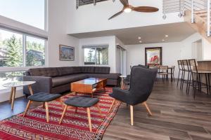 a living room with a couch and chairs and a table at Courchevel C # 9 in Mammoth Lakes