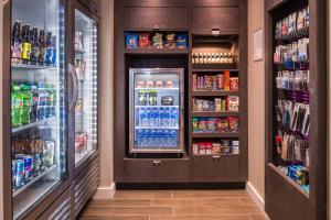 a refrigerator filled with lots of drinks in a store at Residence Inn by Marriott Charlotte Steele Creek in Charlotte