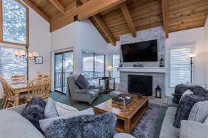 a living room filled with furniture and a fireplace at Val d'lsere # 21 in Mammoth Lakes
