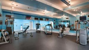 a gym with several tread machines in a room at Best Western Gold Rush Inn in Whitehorse